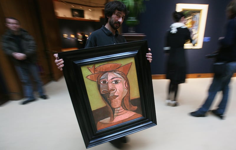 Picasso's Femme Au Chapeau at a Christie's London sale in January 2008. Getty Images