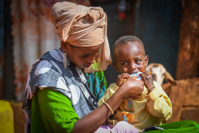 Liben Kefela, 2, with his mother in Ethiopia, where malnourishment levels are dangerously high.

