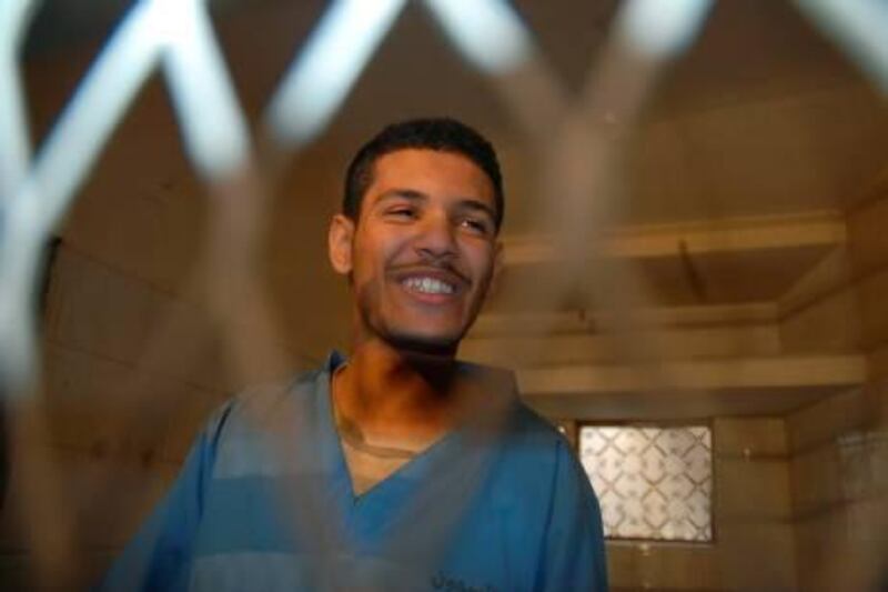 Hisham Mohammed Assem, a Yemeni accused of killing a Frenchman, sits behind the bars at the start of a court hearing in Sanaa on January 17, 2011, during which he was sentenced to death while radical US-born cleric Anwar al-Awlaqi was handed down a 10-year jail sentence in absentia. Assem, who was given the death penalty by the Sanaa criminal court after being convicted of killing French energy contractor Jacques Spagnolo near the Yemeni capital in October, said in court he will appeal the verdict. AFP PHOTO/GAMAL NOMAN
 *** Local Caption ***  071216-01-08.jpg