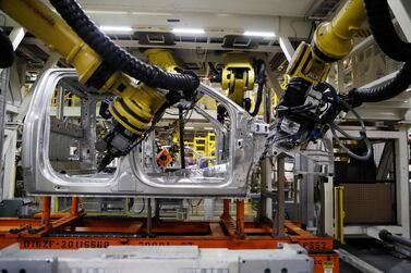 Robots at the Ford Rouge plant in Michigan. The firm will work with US grocer on driverless delivery vehicle. AP