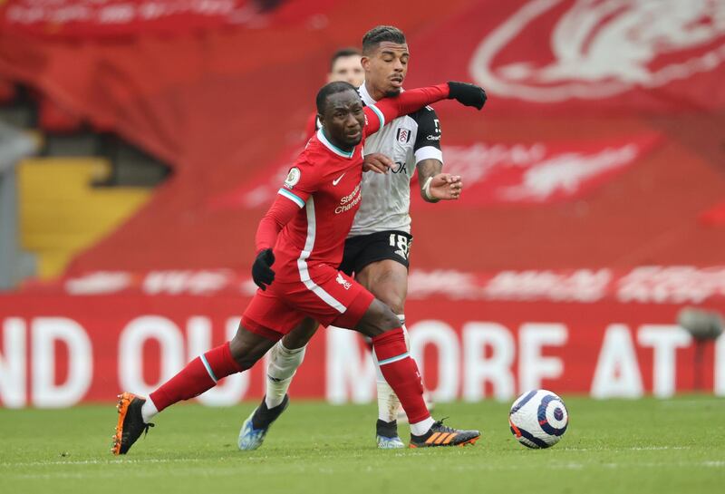 Liverpool's Naby Keita was booked for this challenge on Mario Lemina of Fulham. Reuters