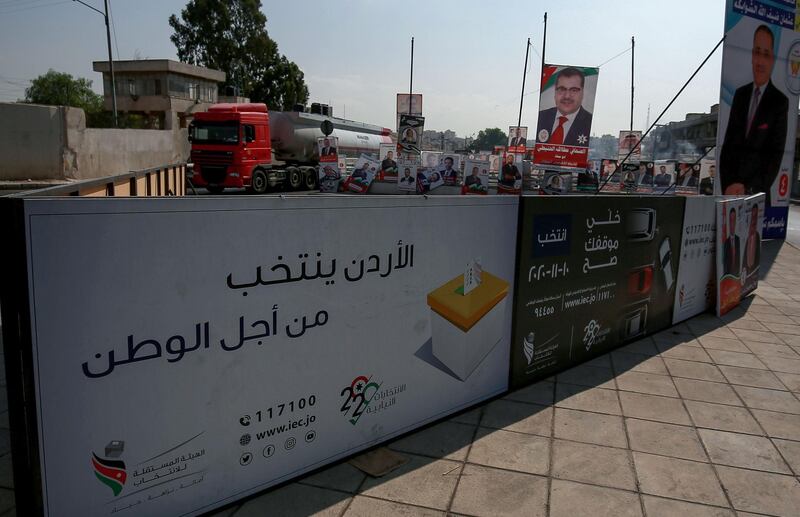 Campaign banners and slogans of candidates for the upcoming Jordanian parliamentary elections line a street in the capital Amman. AFP