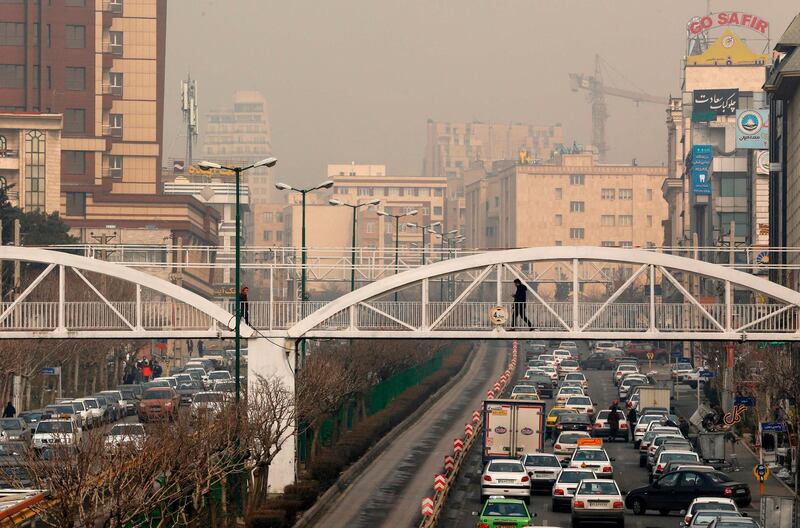 A general view shows traffic in Tehran as heavy pollution hit new highs in Tehran on February 5, 2018.
Primary schools closed as thick fog caused by pollution smothered the Iranian capital and most of the surrounding province, local authorities said. / AFP PHOTO / ATTA KENARE