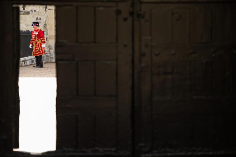 A Yeoman Warder checks on the area around the Middle Tower. Getty Images