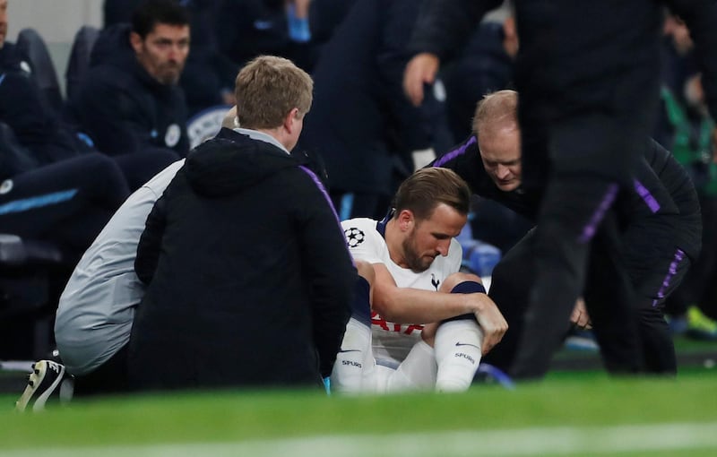 Tottenham's Harry Kane receives medical attention. Reuters