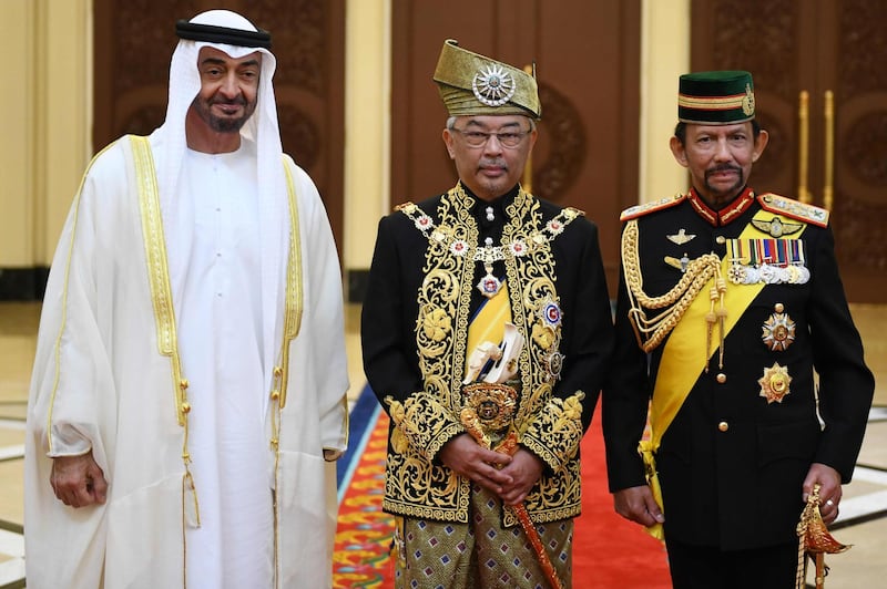 Malaysia's King Abdullah Riayatuddin Al Mustafa Billah Shah poses for a photo with Sheikh Mohamed bin Zayed, left, and Brunei's Sultan Hassanal Bolkiah, right, after his royal coronation at the National Palace in Kuala Lumpur.