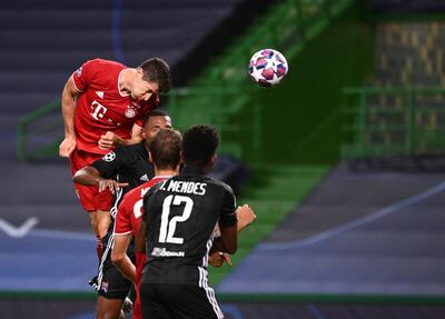 Bayern's Robert Lewandowski, right, scores his side's third goal during the Champions League semifinal soccer match between Lyon and Bayern at the Jose Alvalade stadium in Lisbon, Portugal, Wednesday, Aug. 19, 2020. (Franck Fife/Pool via AP)