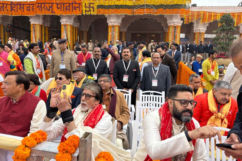 Bollywood actor Amitabh Bachchan, with his son, was among the chief guests at the opening of a temple. AP
