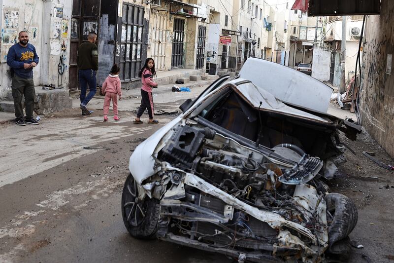 A damaged car in Jenin refugee camp following an overnight Israeli raid. AFP