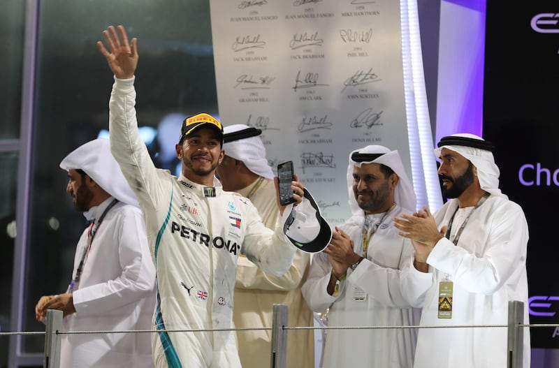 Lewis Hamilton celebrates winning last year's race. Reuters