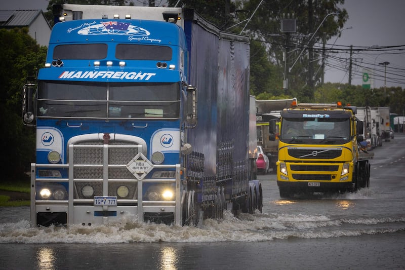 A lorry moves through a flooded road in Brisbane, Australia. AFP