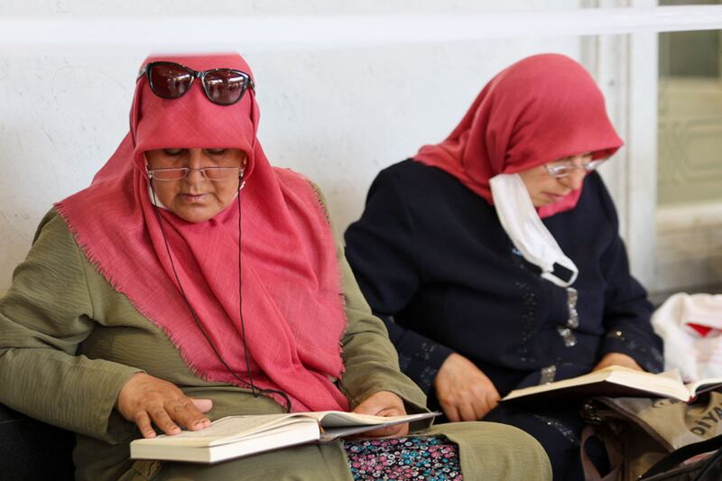 Muslim worshippers read from the Quran at the Grand Mosque. AFP