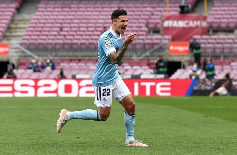 BARCELONA, SPAIN - MAY 16: Santi Mina of Celta Vigo celebrates after scoring their team's first goal  during the La Liga Santander match between FC Barcelona and RC Celta at Camp Nou on May 16, 2021 in Barcelona, Spain. Sporting stadiums around Spain remain under strict restrictions due to the Coronavirus Pandemic as Government social distancing laws prohibit fans inside venues resulting in games being played behind closed doors.  (Photo by David Ramos/Getty Images)