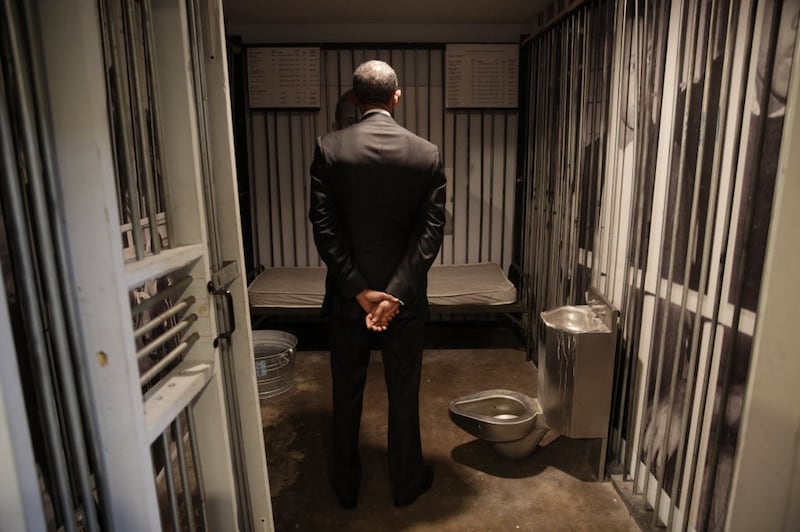 Mr Obama inspects the replica of a prison cell at the National Voting Rights Museum in Selma, Alabama. Photo: The National Archives