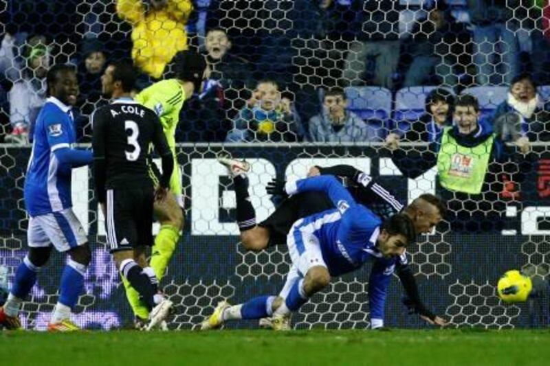 Wigan's Jordi Gomez, second right, beats Chelsea's Raul Meireles, right, to score a goal during their English Premier League soccer match at the DW Stadium, Wigan, England, Saturday Dec. 17, 2011. (AP Photo/Tim Hales) *** Local Caption ***  Britain Soccer Premier League.JPEG-0e08a.jpg