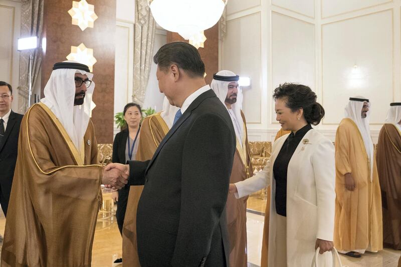 ABU DHABI, UNITED ARAB EMIRATES - July 19, 2018: HE Mohamed Ahmad Al Bowardi, UAE Minister of State for Defence Affairs (L) greets HE Xi Jinping, President of China (2nd L), during a reception held at the Presidential Airport. Seen with Peng Liyuan, First Lady of China (R).


( Mohamed Al Hammadi / Crown Prince Court - Abu Dhabi )
---