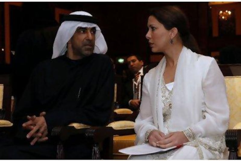 Princess Haya Bint Hussein and Dr Hanif Hassan, the UAE minister of health, converse yesterday between sessions at the Arab Health Congress in Dubai.