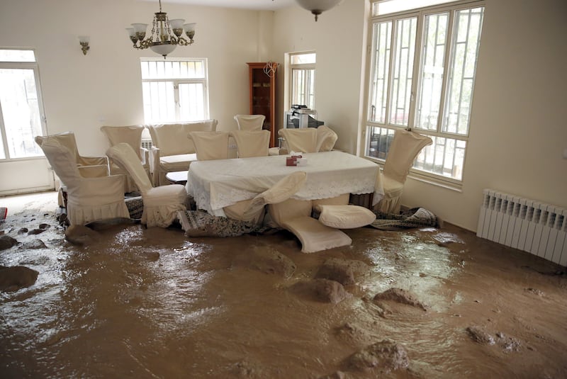 The floods swept mud and debris into this home in Zayegan, Iran. EPA