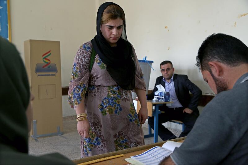 A Kurdish woman in traditional clothes prepares to vote during the Kurdistan parliamentary election at a polling station in Erbil, the capital of the Kurdistan Region in Iraq. With over three million people eligible to vote, the semi-autonomous region is voting on its parliamentary elections a year after a failed bid for independence from Iraq.  EPA