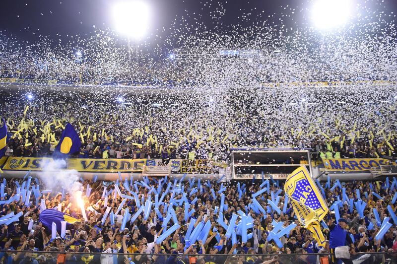 BUENOS AIRES, ARGENTINA - OCTOBER 22: Fans of Boca Juniors throw papers to receive their team prior the Semifinal second leg match between Boca Juniors and River Plate as part of Copa CONMEBOL Libertadores 2019 at Estadio Alberto J. Armando on October 22, 2019 in Buenos Aires, Argentina. (Photo by Rodrigo Valle/Getty Images)