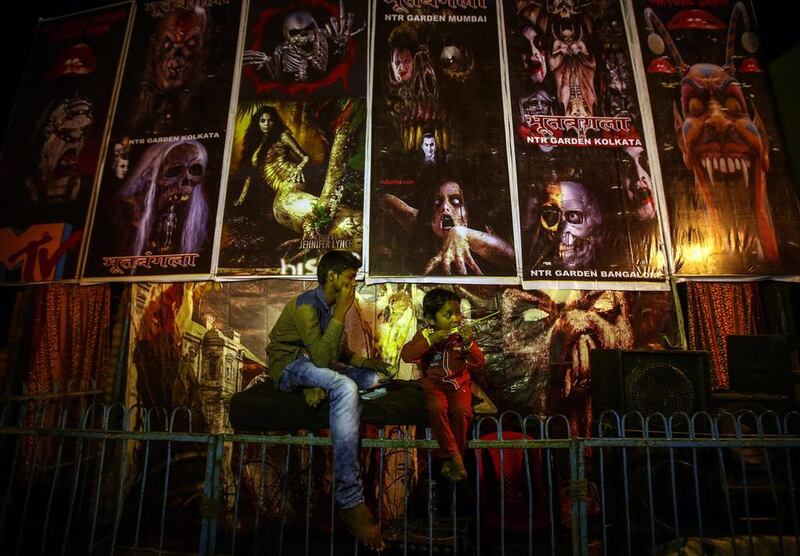 An Indian boy sells tickets for a horror show at an amusement park during the annual Mahim Fair in Mumbai, India. Divykant Solanki/EPA