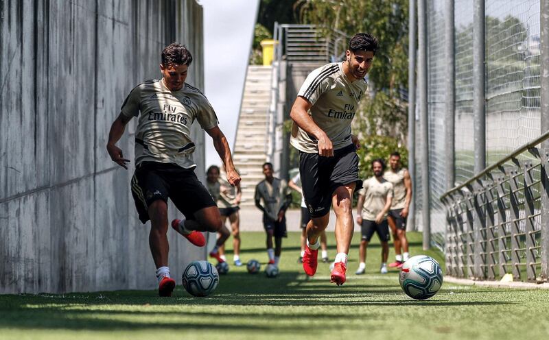 MADRID, SPAIN - MAY 22: Marco Asensio (R) and Brahim Diaz of Real Madrid kick the ball during the team's training session amid Covid-19 pandemic at Valdebebas training ground on May 22, 2020 in Madrid, Spain. (Photo by Antonio Villalba/Real Madrid via Getty Images)