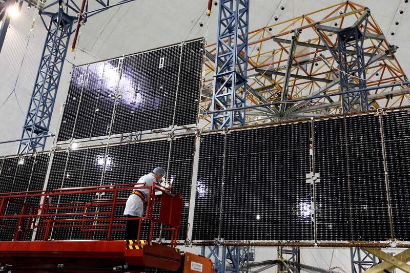Andrei Khrustov, chief engineer of the “Kvant” (Quantum) research and production enterprise, inspects a solar battery for the Express AM6 new generation geostationary telecommunications heavy satellite at the large transformed mechanical systems centre of the Reshetnev Information Satellite Systems company in the Siberian town of Zheleznogorsk. Ilya Naymushin / Reuters