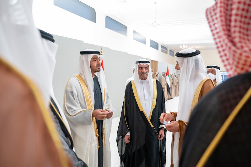 Sheikh Mohamed bin Zayed, Crown Prince of Abu Dhabi and Deputy Supreme Commander of the Armed Forces, left, and Sheikh Hamad bin Mohammed Al Sharqi, Ruler of Fujairah, centre, witness the launch of the UAE's new currency. Seen with Khaled Mohammed Balama, Governor of the Central Bank of the UAE. Mohamed Al Hammadi / Ministry of Presidential Affairs