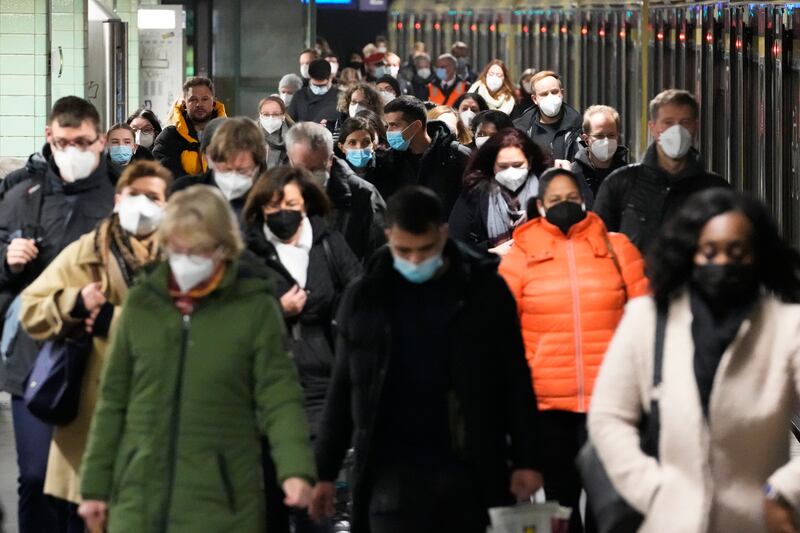 Commuters wearing face masks at a station in central Berlin. Germany recorded more than 50,000 new Covid-19 cases in one day for the first time this week. AP Photo