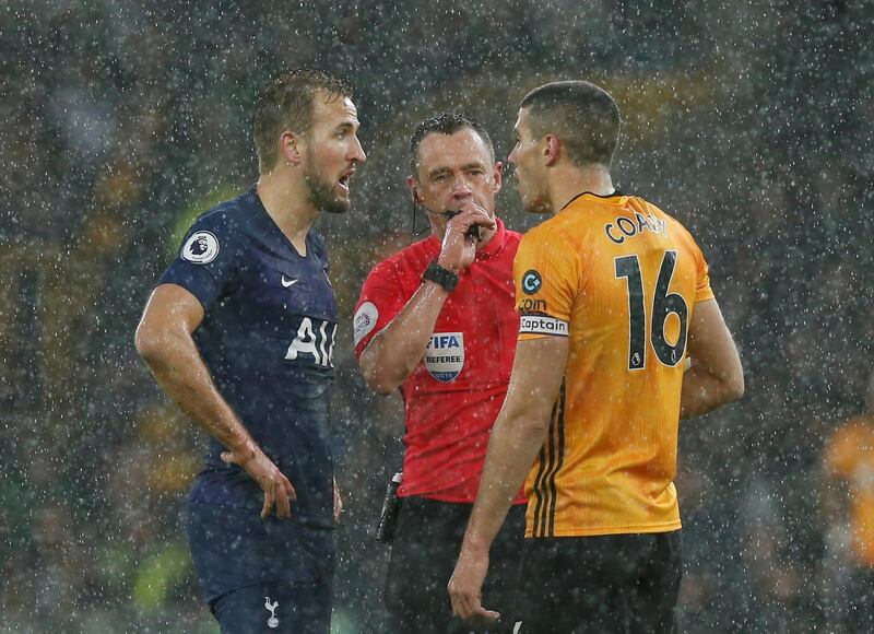 Tottenham Hotspur's Harry Kane talks to Wolverhampton Wanderers' Conor Coady with referee Stuart Attwell. Reuters