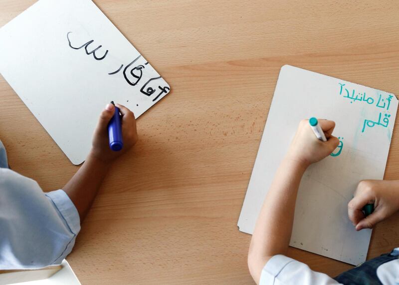 DUBAI, UNITED ARAB EMIRATES, JUNE 02, 2014. 1st year students practise arabic language writing durina a class at Kings' Dubai school located in Umm Suquim. (Photo: Antonie Robertson/The National) Journalist: Roberta Pennington Section: National