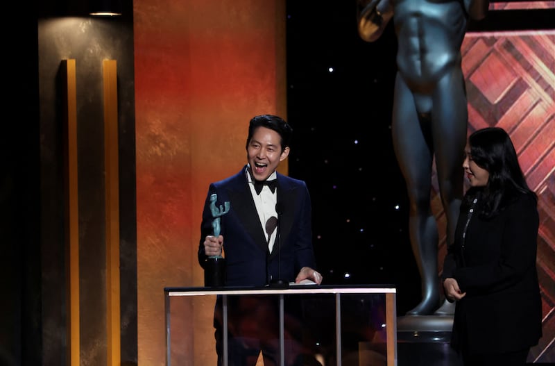 Lee Jung-Jae receives the award for Outstanding Performance by a Male Actor in a Drama Series for 'Squid Game'. Reuters