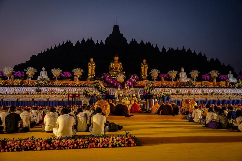 Buddhist followers pray at Borobudur temple during celebrations for Vesak Day in Magelang, Central Java, Indonesia. Getty Images