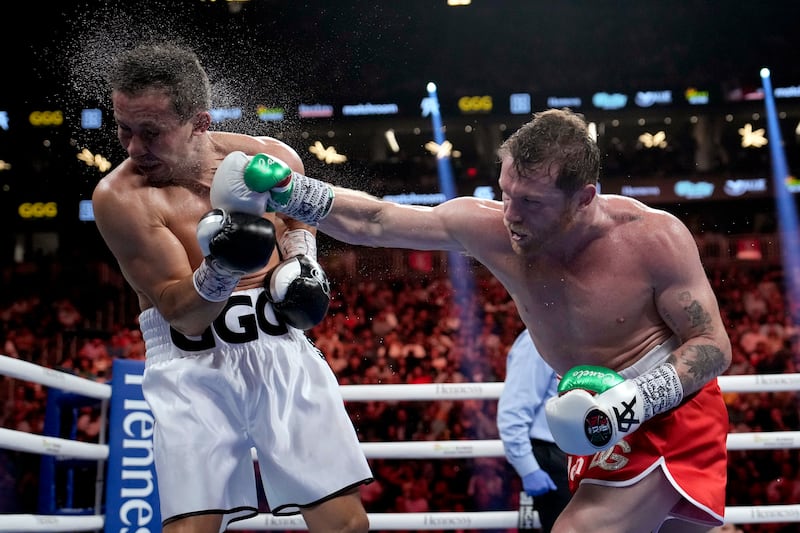 Canelo Alvarez lands a punch on Gennady Golovkin during their super middleweight title bout. AP