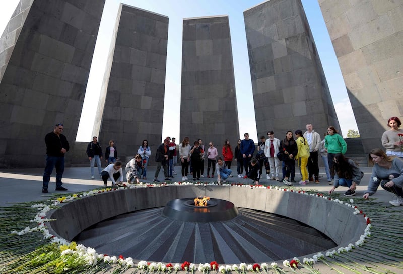 (FILES) In this file photo taken on October 30, 2019, people visit the Tsitsernakaberd Armenian Genocide Memorial in Yerevan. The US Congress on December 12, 2019, formally recognized the 1915-1917 murder of up to 1.5 million Armenians as genocide. The Senate's passage of the repeatedly stalled resolution is expected to anger Turkey, which denies there was a genocidal mass murder, insisting the Armenians died as a result of World War I. / AFP / KAREN MINASYAN
