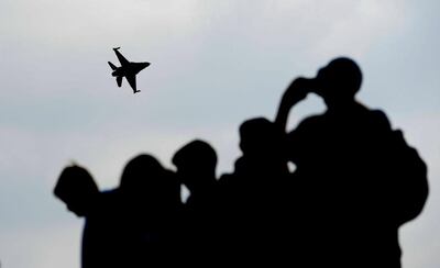 Spectators watch a MiG-29 jet fighter aircraft carrying out a demonstration during Nato Days in Ostrava, Czech Republic. EPA