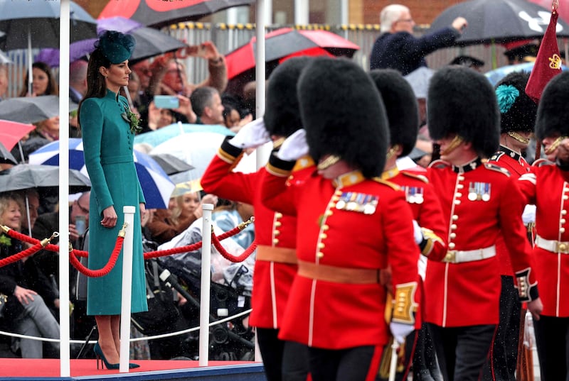 Members of the 1st Battalion Irish Guards salute the Princess of Wales. AFP