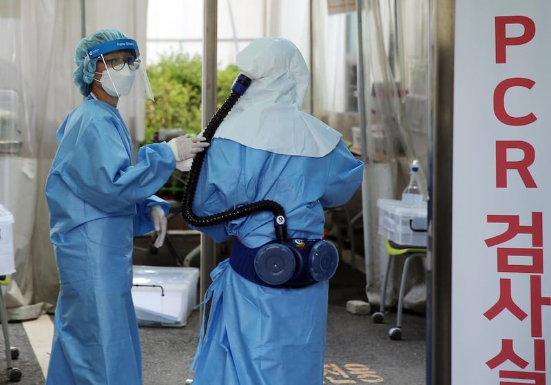Medical workers prepare to carry out Covid-19 tests at a makeshift clinic run by Konyang University Hospital in Daejeon, South Korea. EPA