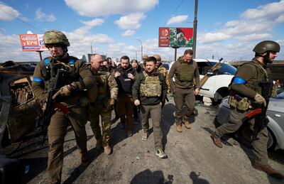 Ukrainian President Volodymyr Zelenskyy walking through Bucha, which has been recaptured by the Ukrainian army. EPA