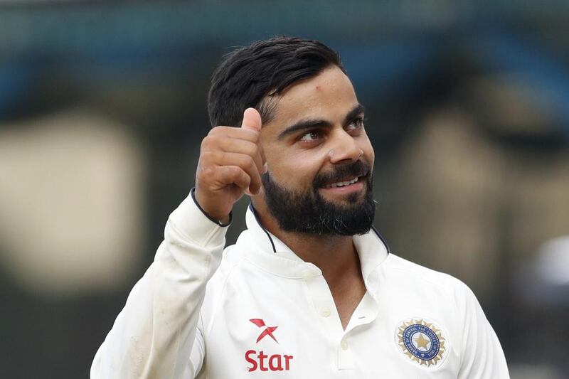 Indian cricket captain Virat Kohli raises his thumb after winning the Test series against England during their fifth day of the fifth cricket Test match in Chennai, India, on December 20, 2016. Tsering Topgyal / AP