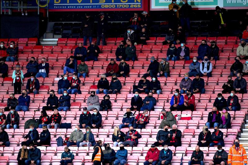 Socially distanced AFC Bournemouth fans in the stands ahead of the Championship match at the Vitality Stadium on Monday May 17, 2021. PA