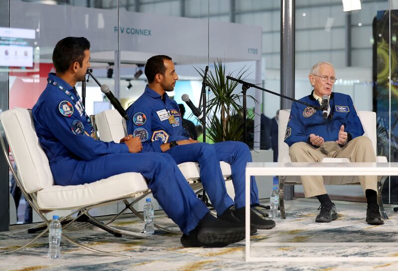 Charles Duke, right, in conversation with UAE astronauts Hazza Al Mansouri, centre, and Sultan Al Neyadi on the second day of the Dubai Airshow.