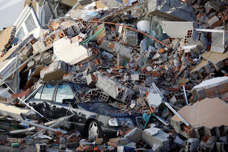 A car is buried in rubble after the earthquake that shook Albania. Reuters