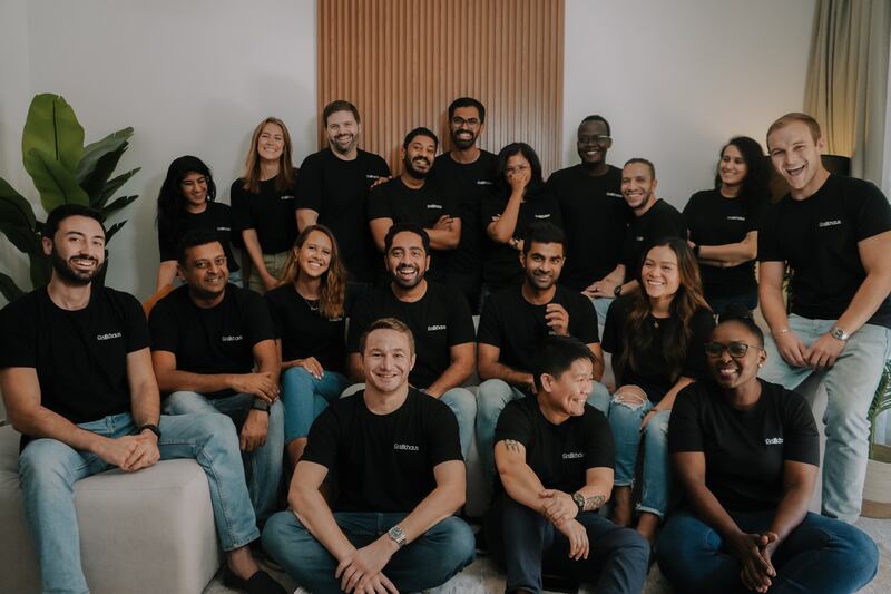 Aahan Bhojani and Ashmin Varma, both seated centre, with their team at property technology start-up Silkhaus. Photo: Silkhaus