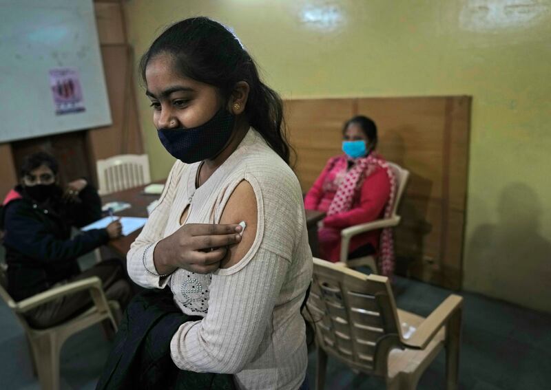 A teenager after being vaccinated at a government school in New Delhi, India. AP Photo