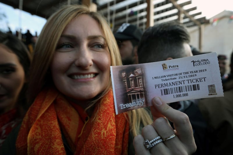 American tourist Allison Carey holds the one millionth ticket. Reuters