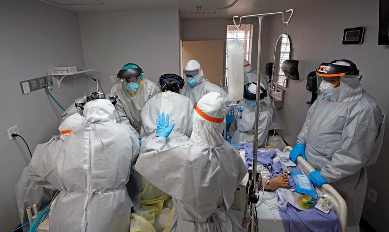 Dr. Joseph Varon, right, leads a team as they try to save the life of a patient unsuccessfully inside the Coronavirus Unit at United Memorial Medical Center in Houston, Texas, USA. AP Photo
