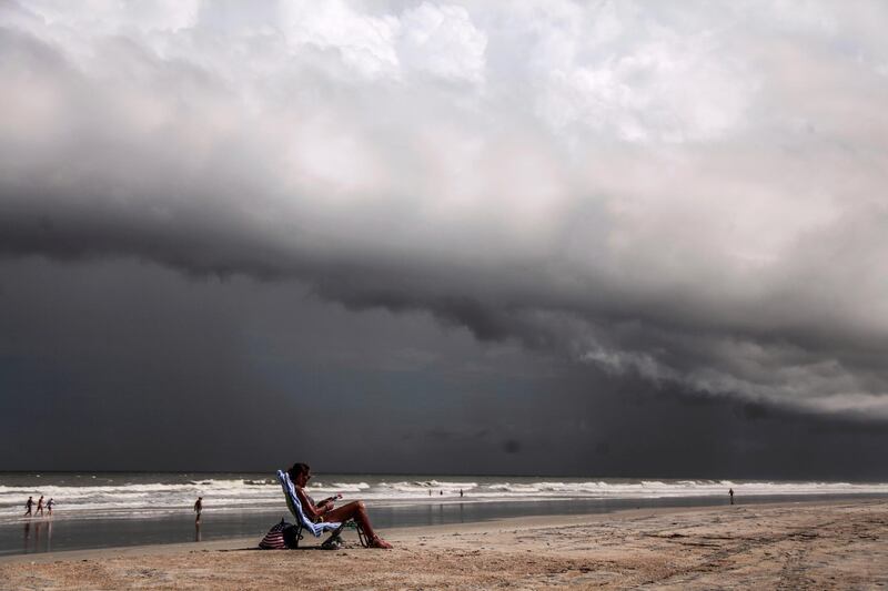Tricia Cheshire, a resident of Amelia Island sunbathes for the last few minutes before storms hit the coast before Hurricane Dorian in Jacksonville. Reuters