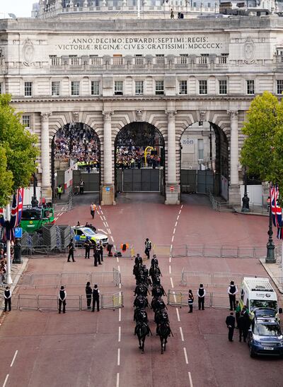 Mounted police pass Admiralty Arch ahead of the ceremonial procession of the coffin of Queen Elizabeth II from Buckingham Palace to Westminster Hall. PA 