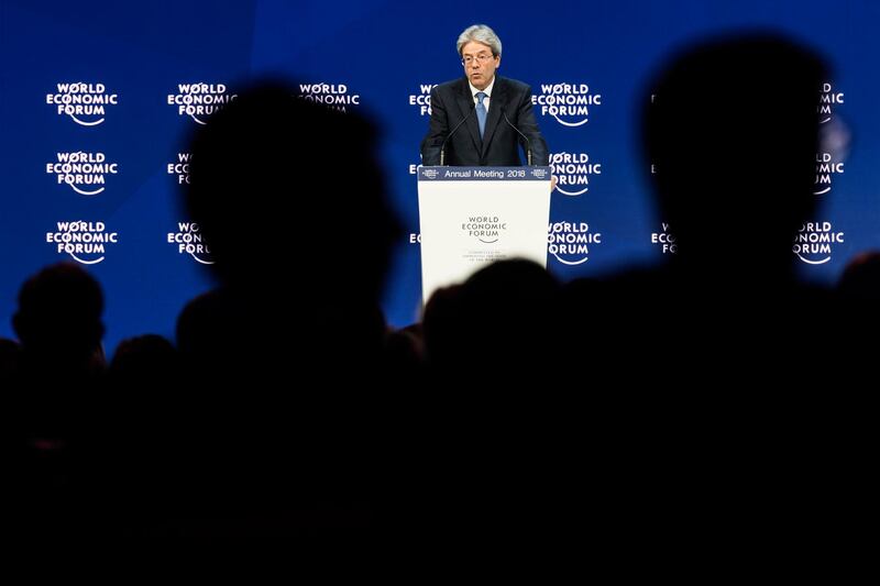 Paolo Gentiloni, prime minister of Italy, addresses a plenary session during the annual meeting of the World Economic Forum in Davos. Laurent Gillieron / Keystone via AP